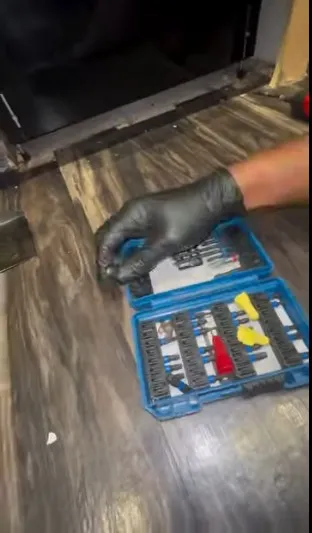 Technician repairing a dishwasher that is not draining in Klamath Falls, OR.