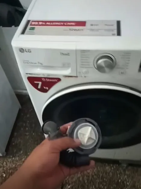 Technician repairing a dryer making loud grinding and squealing noises in Klamath Falls, OR.
