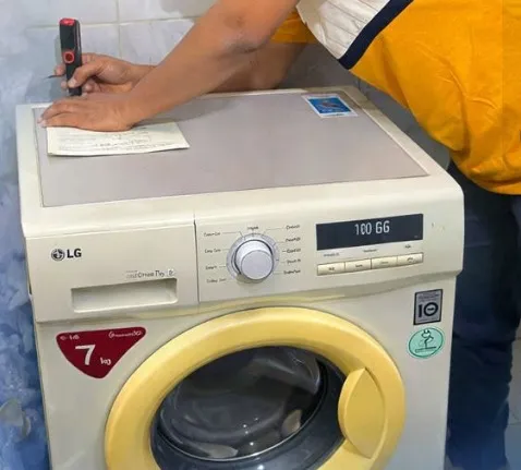 Technician repairing a dryer that is not heating in Klamath Falls, OR.