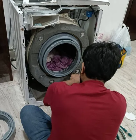 Technician repairing an overheating dryer in a Klamath Falls, OR home.