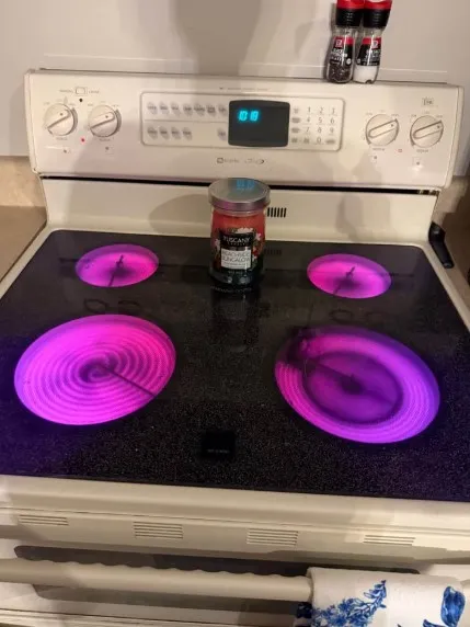 Technician inspecting an oven and stove producing strange noises or burning smells in Klamath Falls, OR.
